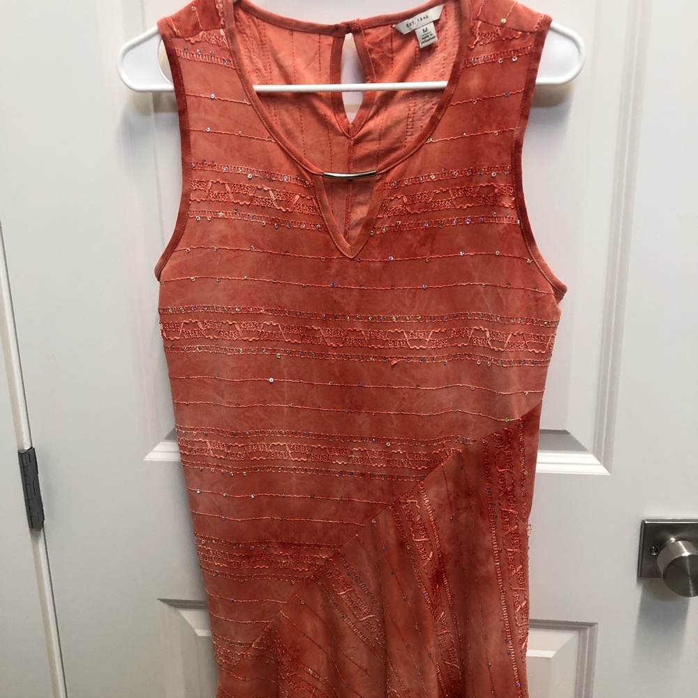 Nylon with sequins fun to front longer than back